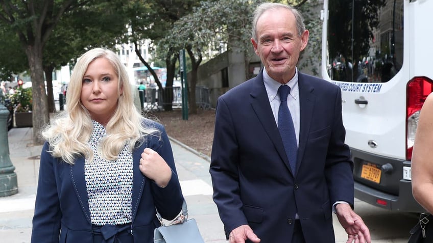 Lawyer David Boies arrives with his client Virginia Giuffre for hearing in the criminal case against Jeffrey Epstein, who died this month in what a New York City medical examiner ruled a suicide, at Federal Court in New York