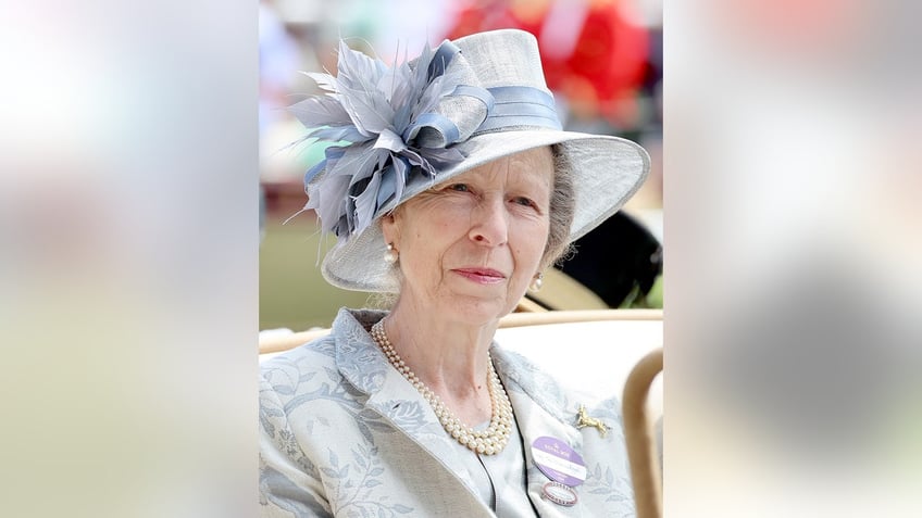 A close-up of Princess Anne wearing a pale blue dress and matching hat.