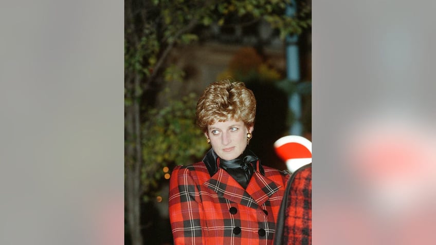 Princess Diana wearing a red plaid jacket