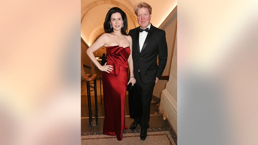 Charles Spencer in a tux and Karen Spencer in a strapless red dress