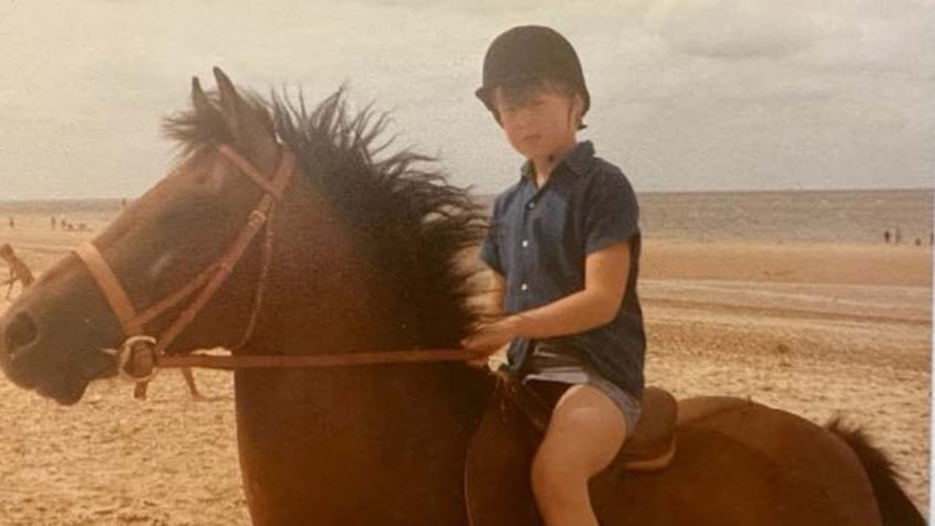 Charles Spencer riding a horse