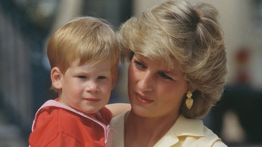 A close-up of Princess Diana holding Prince Harry.