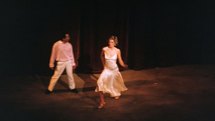 Princess Diana dancing to Uptown Girl in a white dress