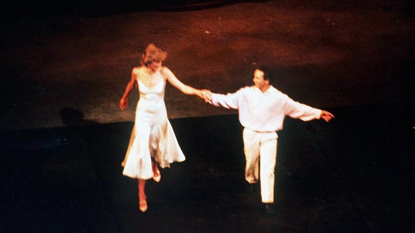 Princess Diana dancing with Wayne Sleep on stage.