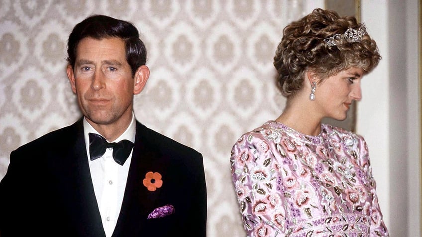 Prince Charles and Princess Diana looking away from each other