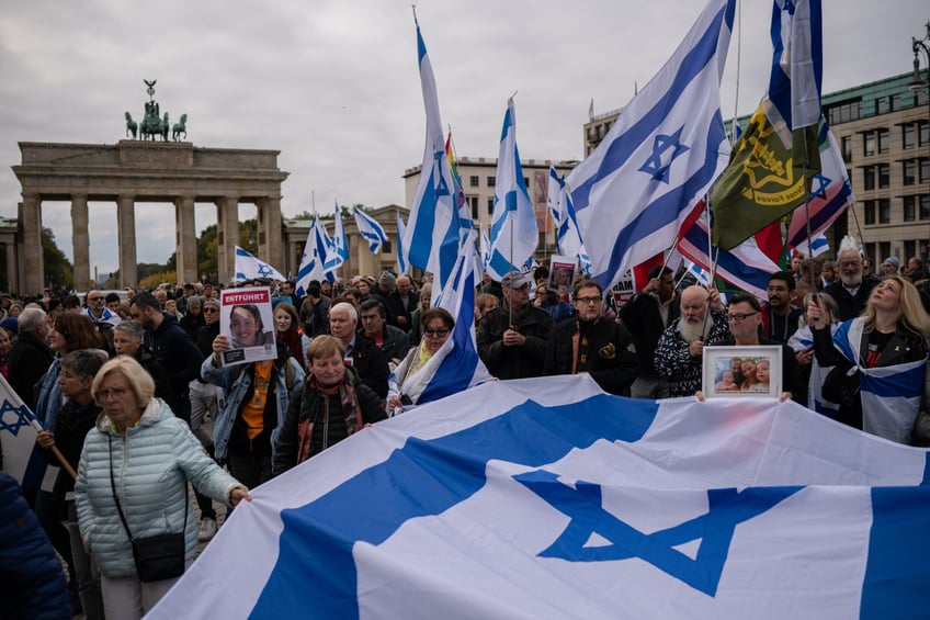 BERLIN, GERMANY - OCTOBER 6: People march to commemorate the victims of the October 7, 2023 Hamas attack and massacre in southern Israel on October 6, 2024 in Berlin, Germany. People are taking to the streets across Berlin and other cities in Germany today to commemorate the 1,139 people killed and approximately 250 kidnapped in the Hamas incursions. Other marches are also taking place to protest against Israel's heavy-handed response in Gaza that has led to the deaths of tens of thousands of Palestinians. (Photo by Tamir Kalifa/Getty Images)