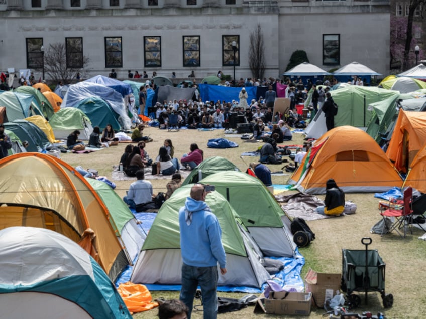 NEW YORK, NEW YORK - APRIL 26: Columbia University students participate in an ongoing pro-Palestinian encampment on their campus following last week's arrest of more than 100 protesters on April 26, 2024 in New York City. In a growing number of college campuses throughout the country, student protesters are setting up tent encampments on school grounds to call for a ceasefire in Gaza and for their schools to divest from Israeli companies. (Photo by Stephanie Keith/Getty Images)