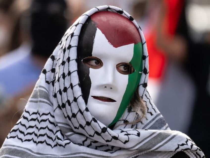 Los Angeles, CA - December 26:Pro-Palestinian protestors march through Little Tokyo in Los Angeles on Tuesday, December 26, 2023. Community members and grassroots organizations in Los Angeles held a day of action against state terror and oppression of Palestine by Israel. (Photo by David Crane/MediaNews Group/Los Angeles Daily News via …