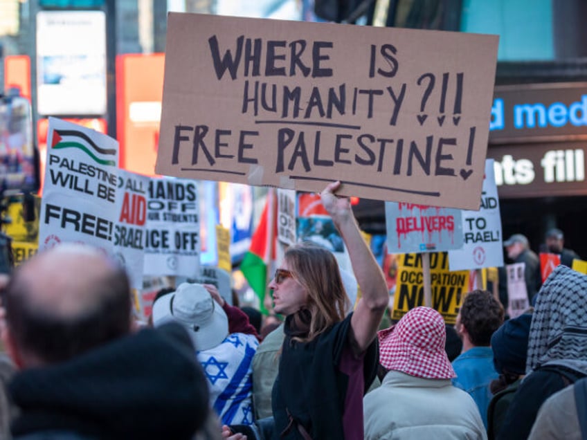 NEW YORK CITY, NEW YORK, UNITED STATES - 2025/03/18: A pro-Palestine protestor holds a sig