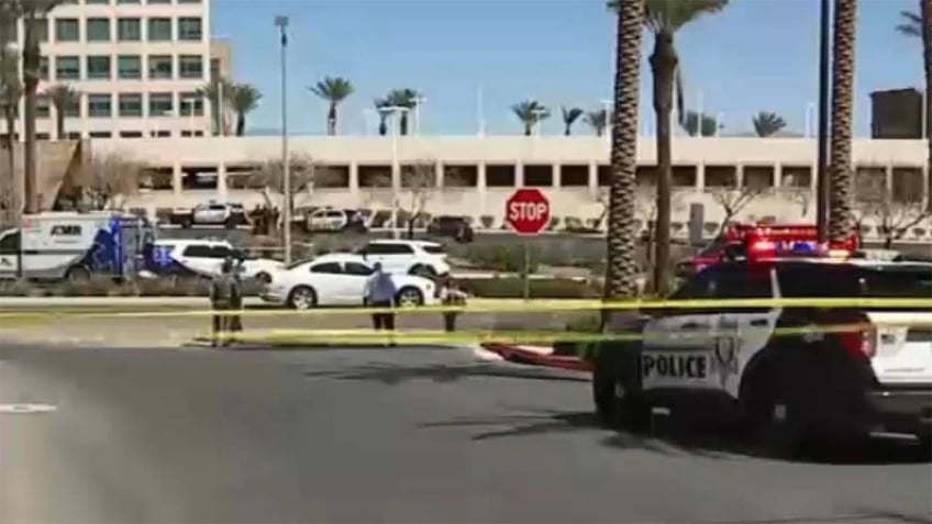 Police at the building where the shooting happened