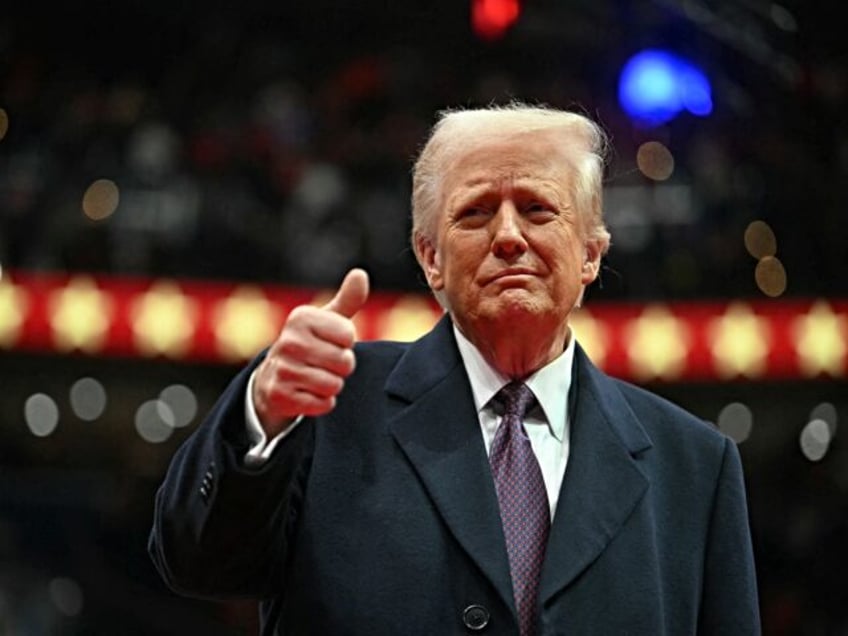 US President Donald Trump give the thumbs up during the inaugural parade inside Capitol On