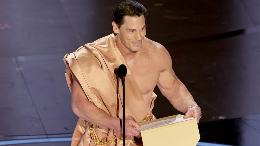 John Cena wears a toga