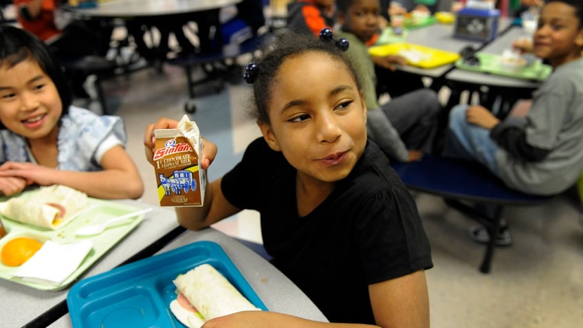 Student with chocolate milk