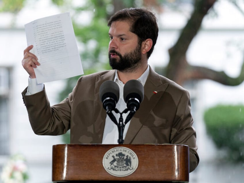 Chile's President Gabriel Boric speaks at the site of the assassination of Orlando Le