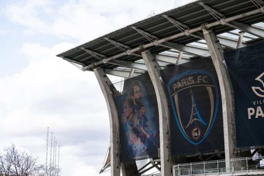 The Paris FC logo, featuring the Eiffel Tower, on display outside their Stade Charlety hom