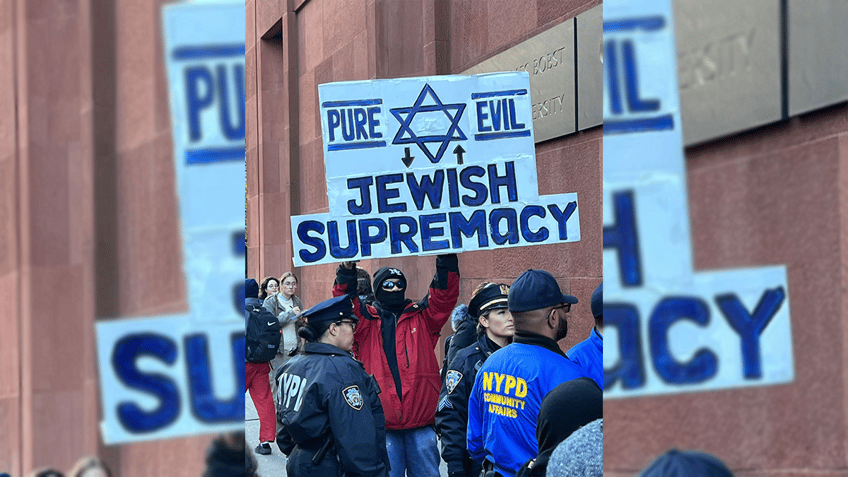 protester at nyu pro palestinian rally spits on jewish sign equates with white supremacy