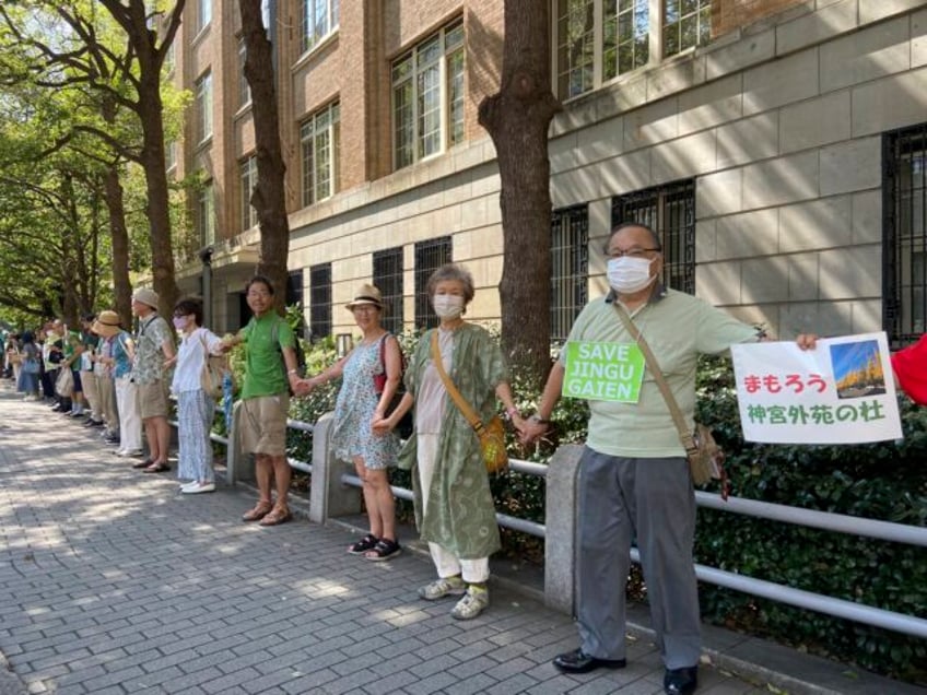 protesters demand that japan save 1000s of trees by revising a design plan for a popular tokyo park