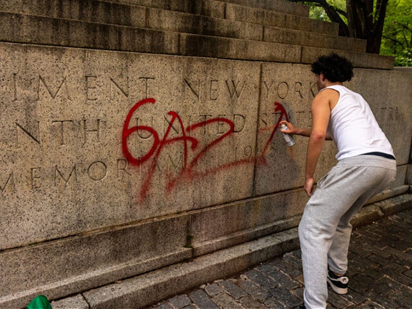 NEW YORK, NEW YORK - MAY 6: A pro-Palestine protestor writes Gaza on a memoriam near Centr