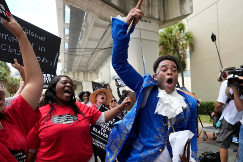 protesters march through miami to object to floridas black history teaching standards