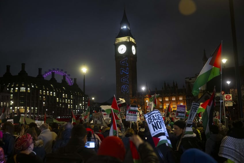 protesters write from river to the sea antisemitic chant on side of parliament in massive 25 foot tall letters