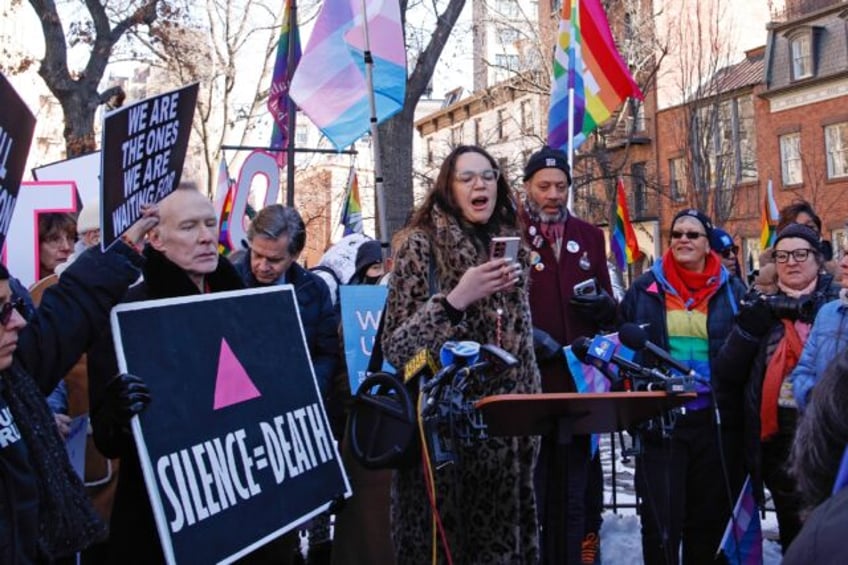 Demonstrators rally against the removal of references to transgender and queer people on t