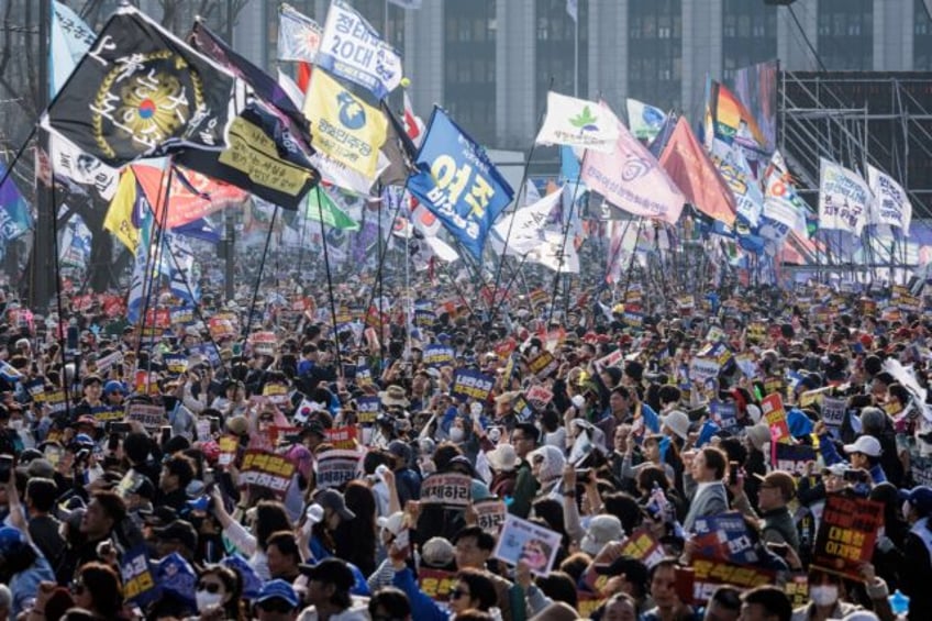 Protesters attend a demonstration against impeached South Korean President Yoon Suk Yeol i