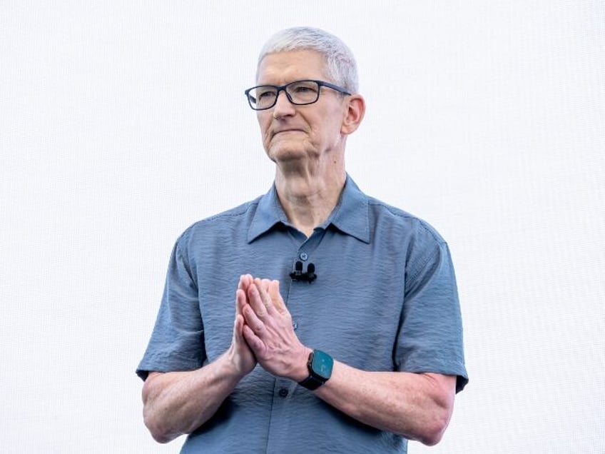 Tim Cook with pleading hands