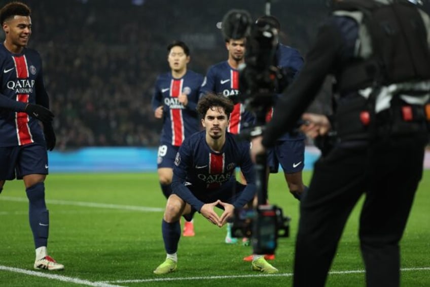 Vitinha (C) celebrates after scoring Paris Saint-Germain's second goal in their 3-1 win ov