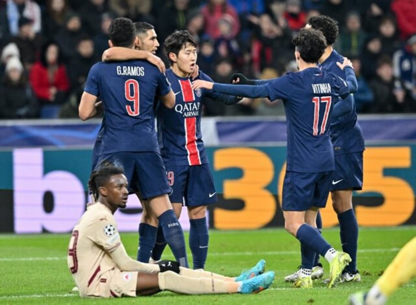 PSG players celebrate after number nine Goncalo Ramos (L) put them ahead against Salzburg