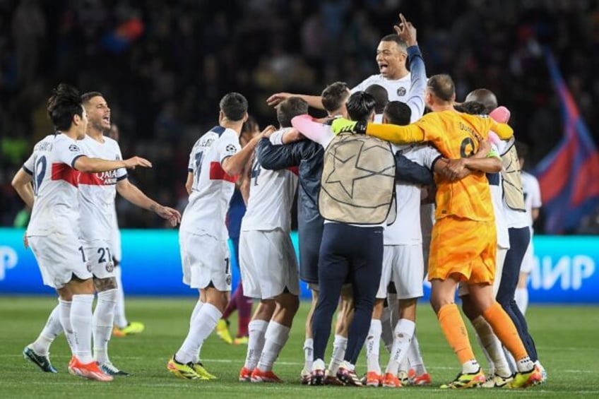 Kylian Mbappe and his teammates celebrate after Paris Saint-Germain beat Barcelona to reac