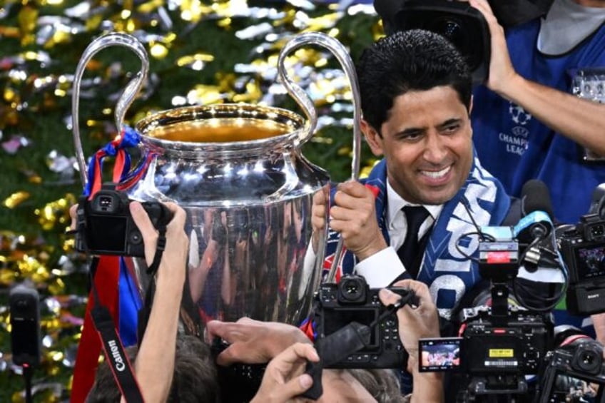 Paris Saint-Germain's Qatari president Nasser al-Khelaifi with the Champions League trophy