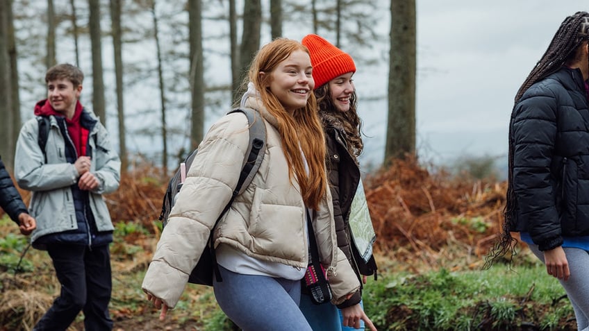 teenagers on a walk through the woods