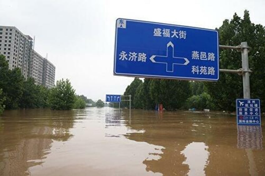 public anger grows after floodwaters deliberately diverted to save chinas capital