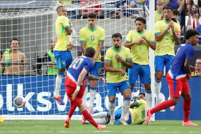 USA captain Christian Pulisic scores from a free-kick in Wednesday's 1-1 draw with Brazil