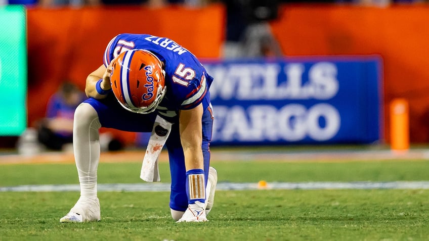 punches thrown at end of florida tennessee game following contact on gators quarterback kneel