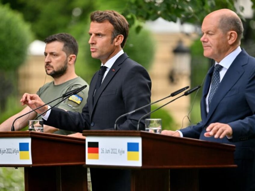 (From L) Ukrainian President Volodymyr Zelensky, President of France Emmanuel Macron and C