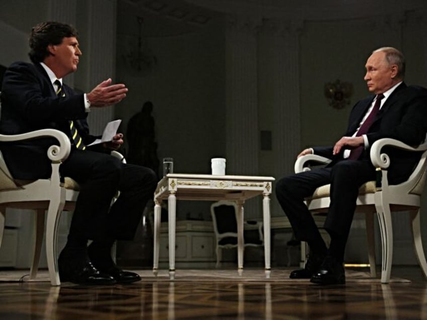 In this pool photograph distributed by Russian state agency Sputnik, Russia's President Vl