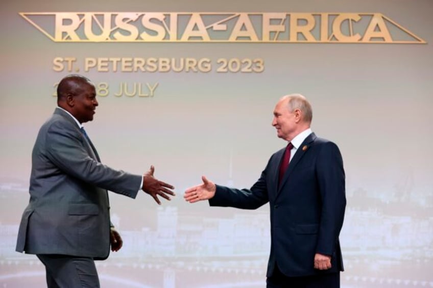 putin woos african leaders at a summit in russia with promises of expanding trade and other ties