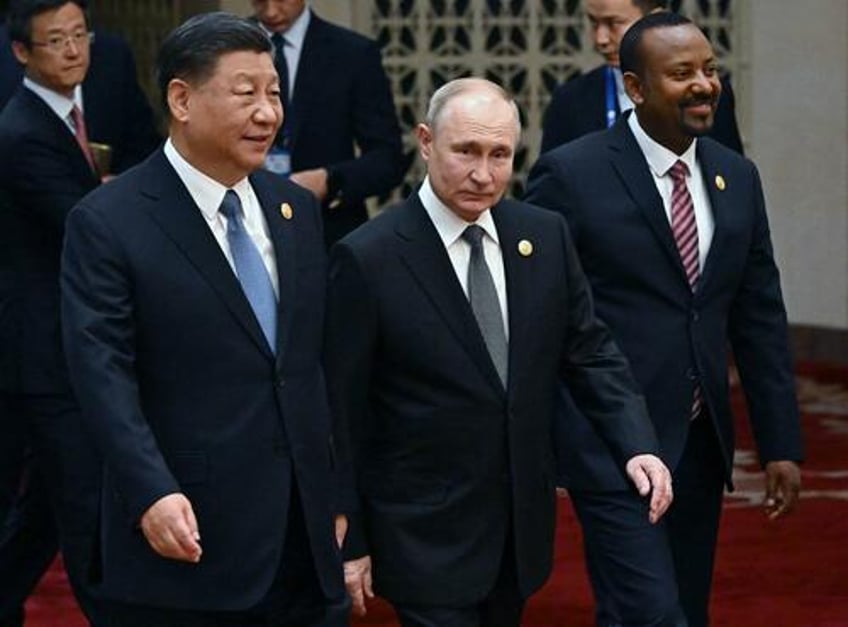 putin xi in beijing pitch for alternative world order as biden departs a burning middle east