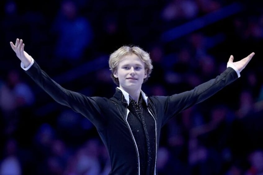 Ilia Malinin acknowledges fans after winning a second straight US men's figure skating title in Columbus, Ohio