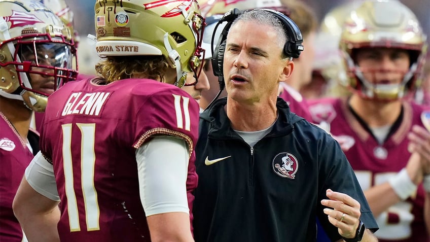 Mike Norvell talks to his quarterback