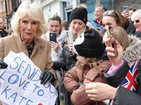 Queen Camilla says Kate Middleton will be 'thrilled' as she accepts touching sign from two young fans