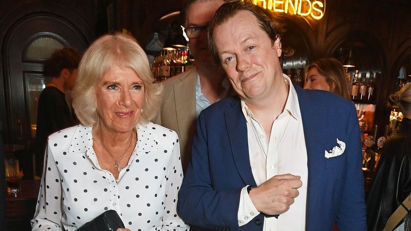 queen camilla standing next to her son thomas parker bowles