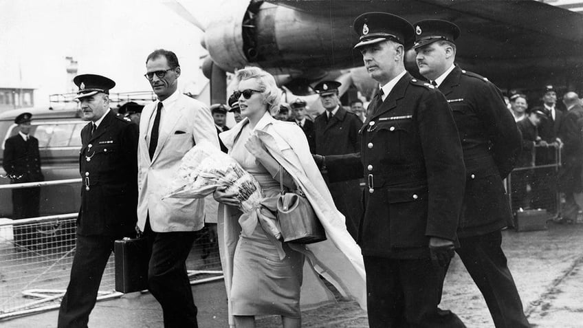 Marilyn Monroe arriving in the U.K. with Arthur Miller.