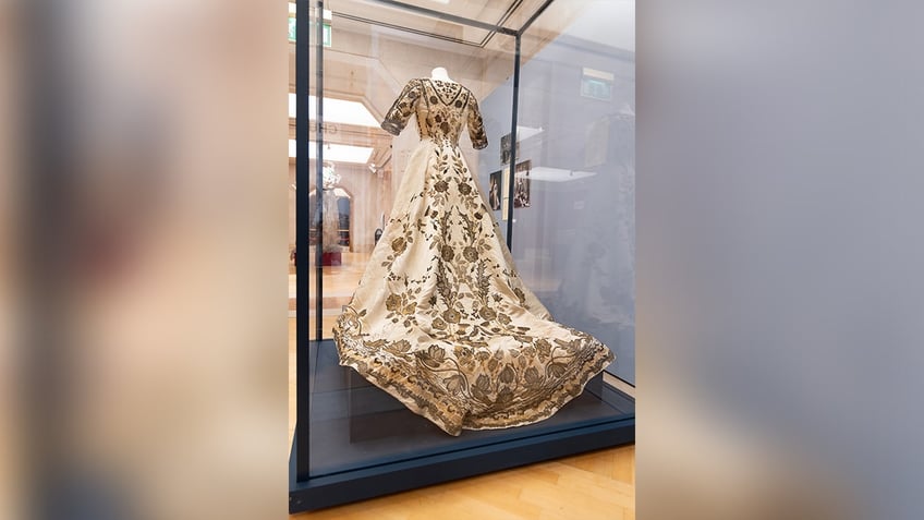 queen elizabeth is only surviving dress is on display in london plus other royal attire and treasures