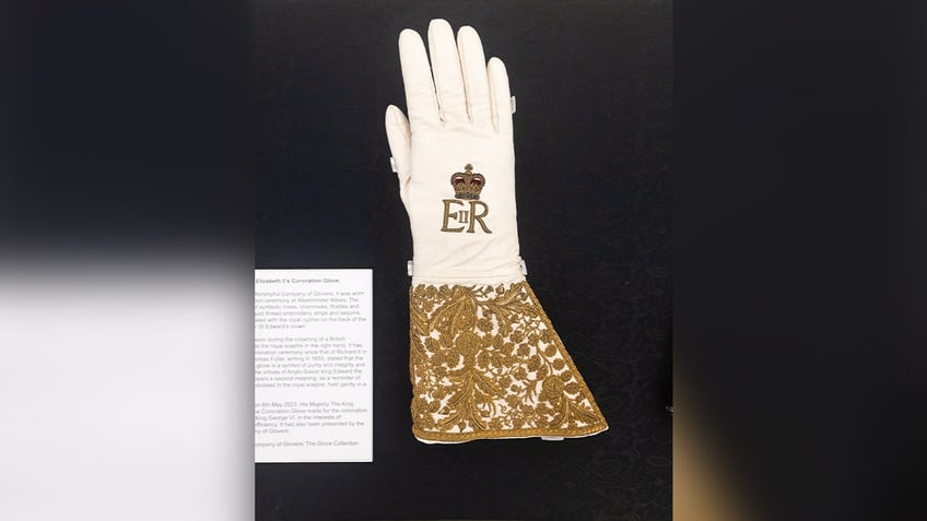 queen elizabeth is only surviving dress is on display in london plus other royal attire and treasures