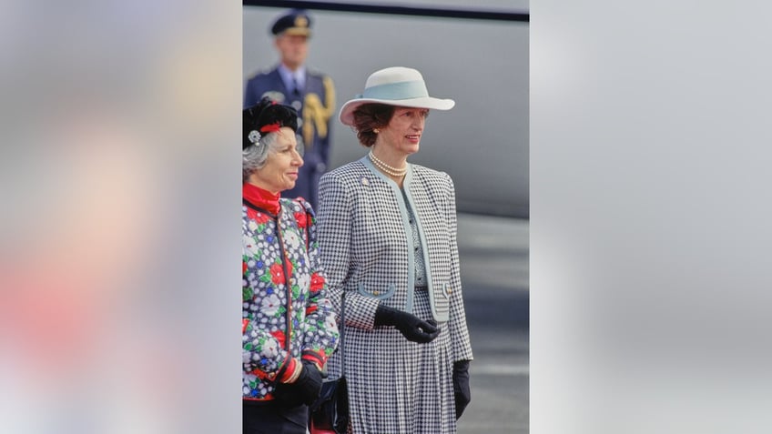 Queen Elizabeth IIs confidantes standing side-by-side.