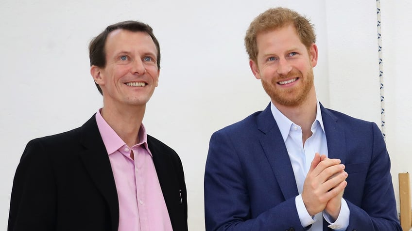 Prince Joachim smiling alongside Prince Harry