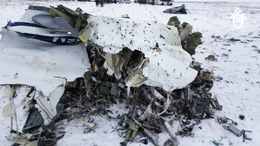 questions remain unanswered as russia and ukraine blame each other for transport jet crash