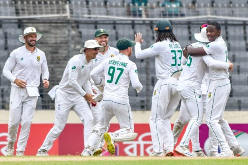 South Africa's Kagiso Rabada celebrates with teammates after taking a wicket